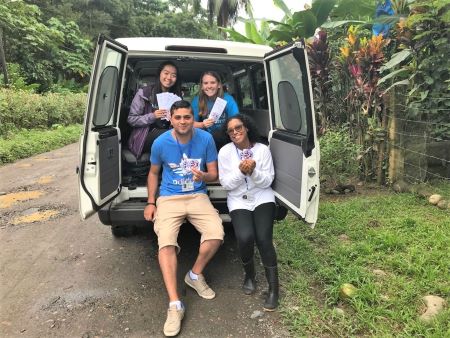 Jade Tso and three colleagues in the back of a parked van while conducting mosquito prevalence research in Costa Rica