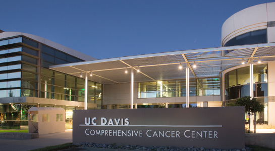 Exterior photo of the UC Davis Comprehensive Cancer Center building and signage