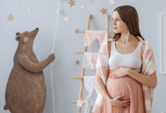 pregnant mom in childs room