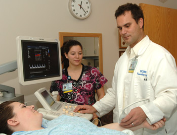David Del Pizzo consults with a patient.</
