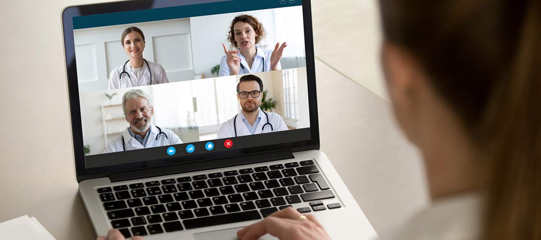 Virtual tumor board physicians meeting virtually on computer