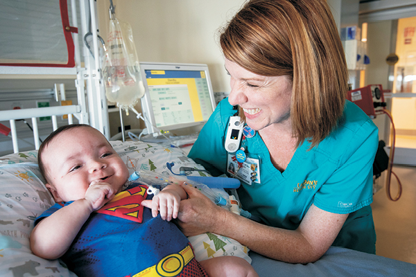 	Christa Bedford-Mu with pediatric patient Gabe King