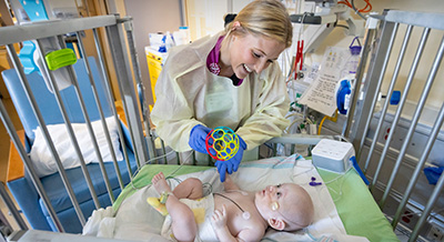 NICU nurse taking care of a pediatric patient