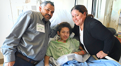 Alex Gonzalez with his parents after surgery