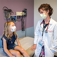 Pediatric diabetes patient Scarlett and her doctor
