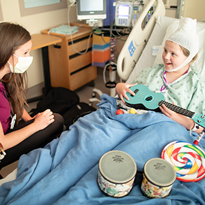 Child Life specialist and patient during music therapy
