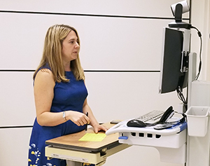 Kristin Hoffman, M.D., conducts a telehealth session.