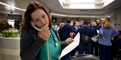 Nurse on phone in emergency department (c) UC Regents. All rights reserved.