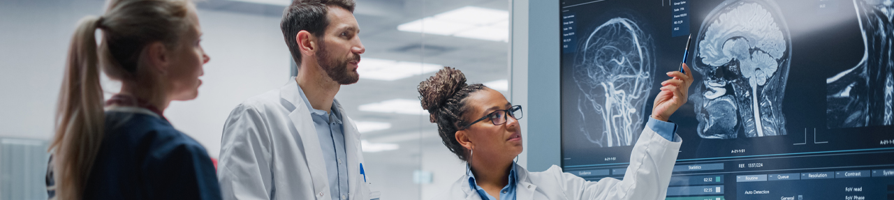 Physicians looking at brain scans. (C) UC Regents. All rights reserved.