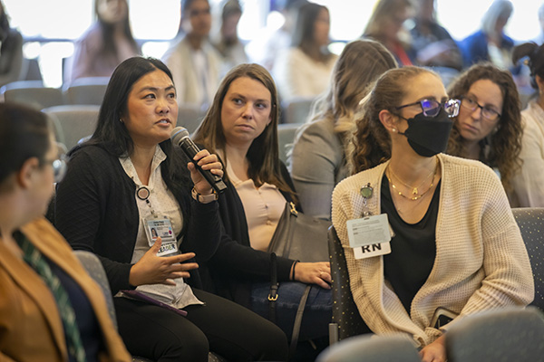 Conference attendees engaging in a question and answer period. 