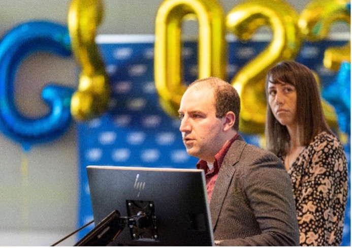 Evan Giusto and Erin Riley presenting their research at the 2023 Nursing Science and Professional Governance Conference. 