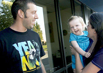 Sadie and her parents outside the medical center