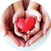 adult and child hands holding heart shape