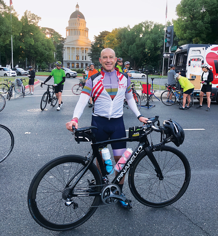 David Lubarsky during a cycling stop at California’s state Capitol building. Lubarsky is an avid cyclist and sprint triathlete, and founded what is now the nation’s oldest college ballroom dancing club while studying at Washington University.