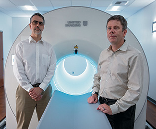 Ramsey Badawi and Simon Cherry with EXPLORER, the world’s first total-body PET scanner that they developed at UC Davis.