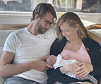 Kellie Corcoran pictured with her husband and baby
