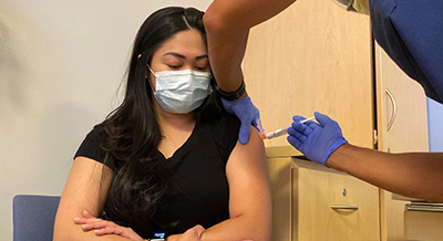 Woman getting a booster vaccine