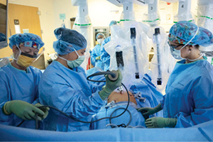 Team performing robotic surgery
