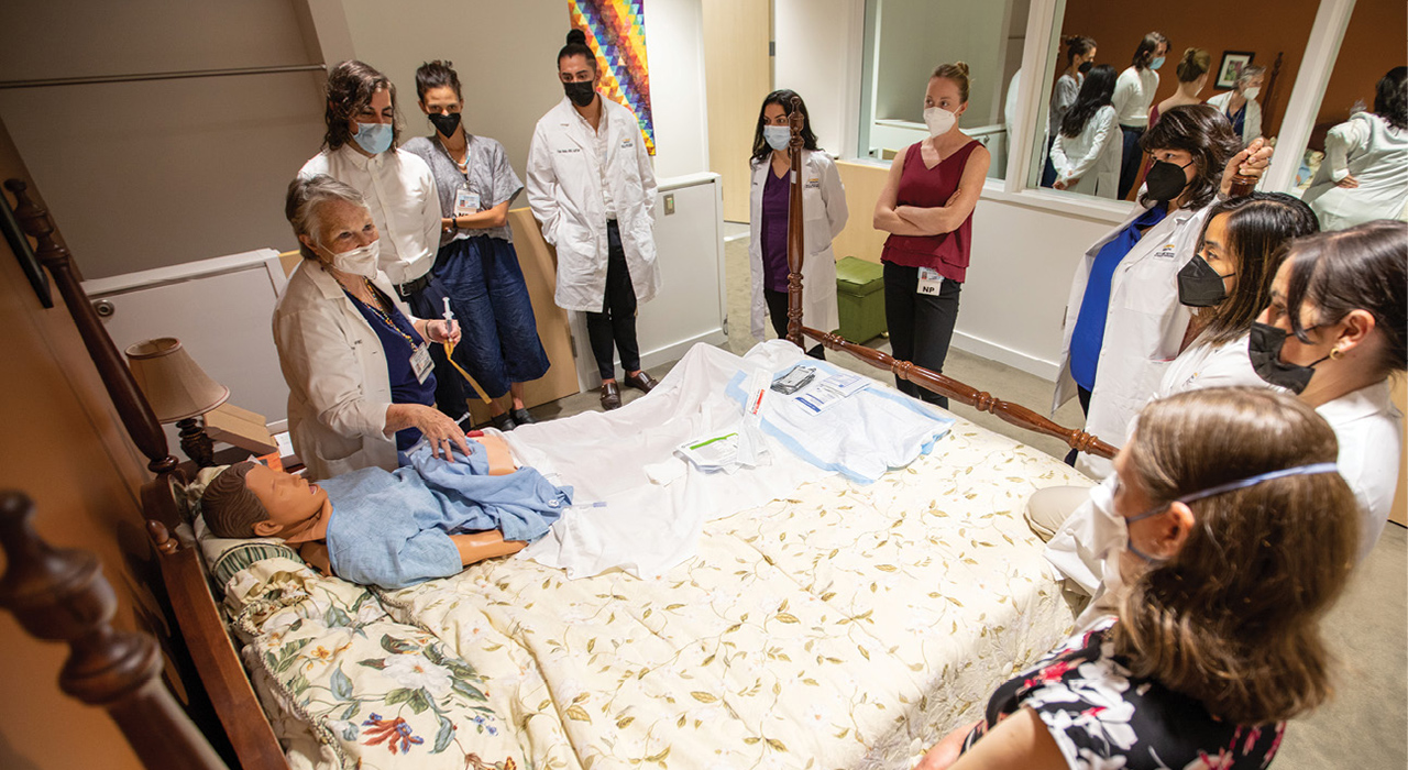 UC Davis Health nurse practitioner residents practice GI tube management in a Betty Irene Moore School of Nursing simulation suite.
