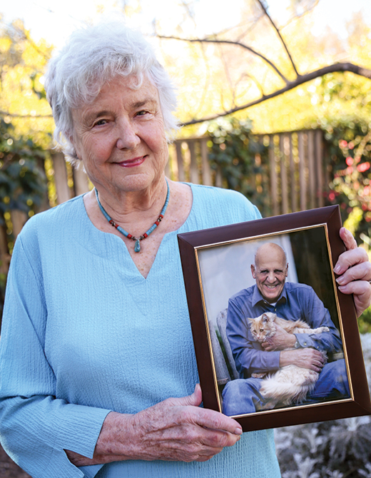 Judith Bailey Gabor with a portrait of her husband, the late UC Davis neurology professor and former department chair Andrew John Gabor, M.D., Ph.D. A gift from Judith, family and friends established the UC Davis School of Medicine’s first presidential chair in Dr. Gabor’s name.