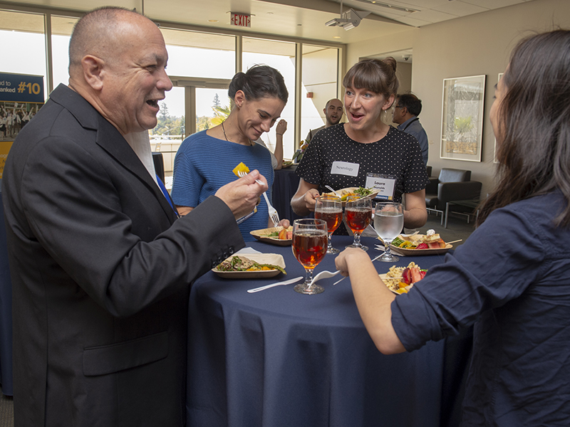 Jesse Dominguez (B.S. ’82, M.D. ’88) shares insights with current students at the weekend’s traditional mentoring lunch.