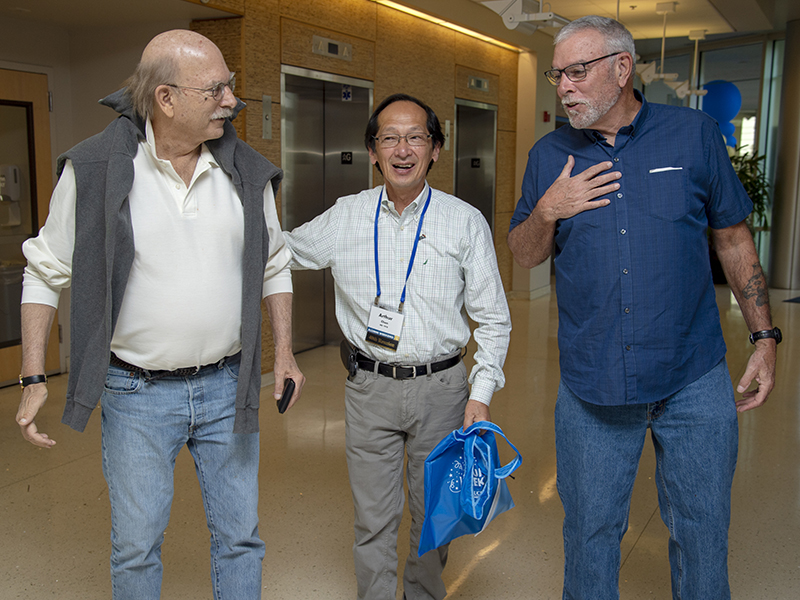 Class of ’76 members Bill DeWolf, Art Chen and George Palma catch up.