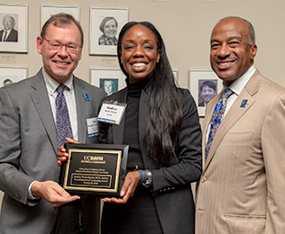 Nadine Burke Harris (M.D., ’01), with Chancellor Gary S. May and Interim Dean Lars Berglund