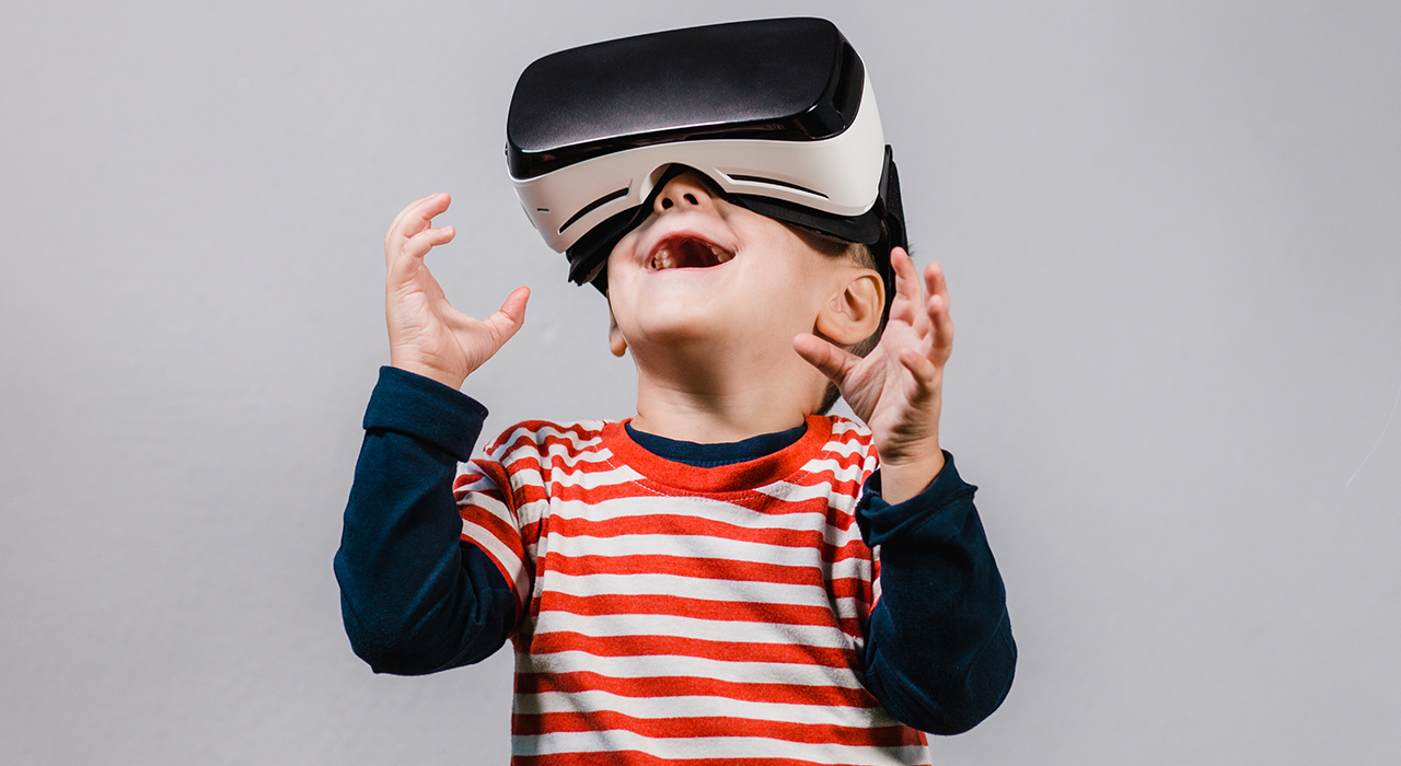 Child wearing virtual reality goggles