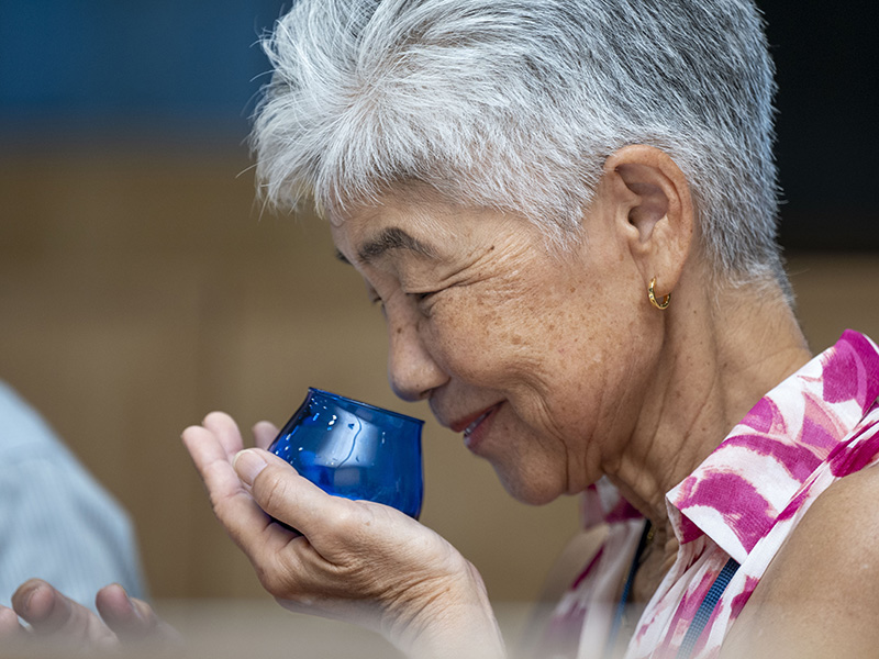 Kimie Hirabayashi (M.D. ’84) participates in the olive oil tasting at the Sensory Theater, Robert Mondavi Institute.