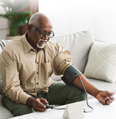 Man taking his blood pressure-index