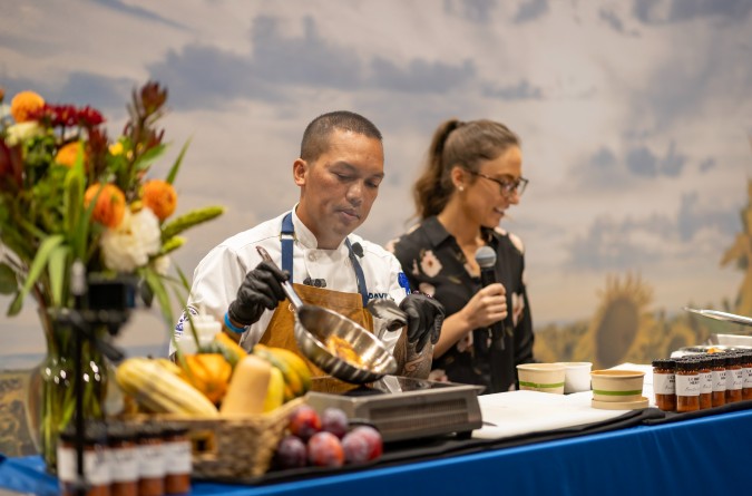 Chefs cooking chicken during a food demo
