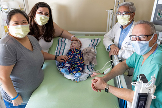 Infant Carter surrounded by health care workers