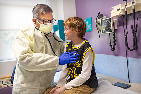 Pediatric pulmonologist with patient