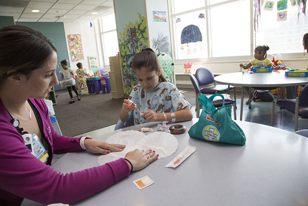 child life specialist working with child patient