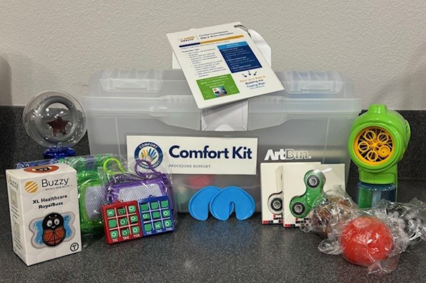 Contents of the comfort kit, including fidget spinners, games and bubbles