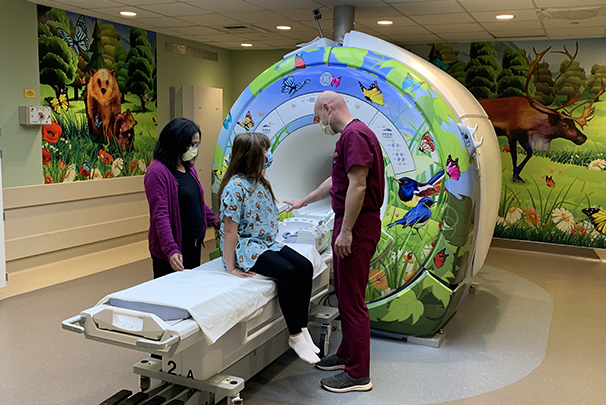 Colorful murals of nature on the walls of the MRI room