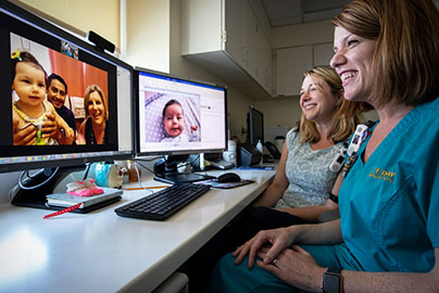 A UC Davis nurse and neonatologist on a telehealth video call