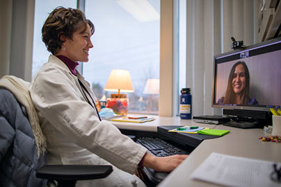 Dr. Crossen providing a telehealth consult via computer
