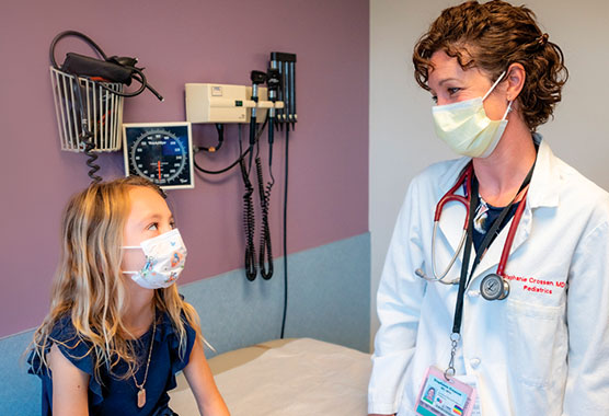 Pediatric patient with UC Davis endocrinologist receiving follow-up care
