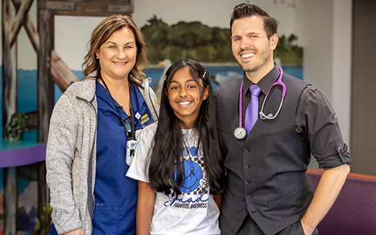 Pediatric diabetes patient Melina with her doctors