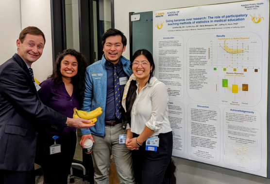 UC Davis Prof. Jeffrey Hoch with first year medical students and their research poster. 