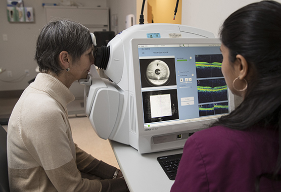 Woman getting an eye exam for diabetic retinopathy in an eye clinic.