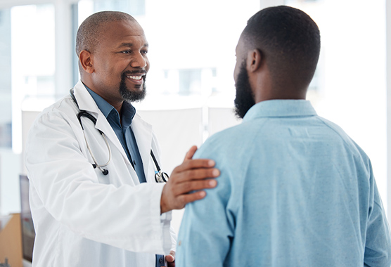 Male patient talking to urologist about hypogonadotropic hypogonadism.