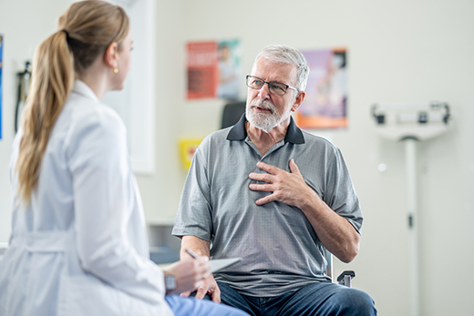 Male patient talking to a female health care provider in a clinic