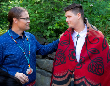 Erik Brodt, M.D., of Oregon Health and Science University (OHSU), with student Jacob Smith, at the Wy'east post-bac pathway graduation in Portland 