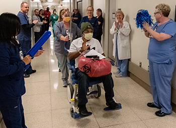 UC Davis Medical Center staff provide a special farewell for a patient who spent two weeks in the hospital for COVID-19.