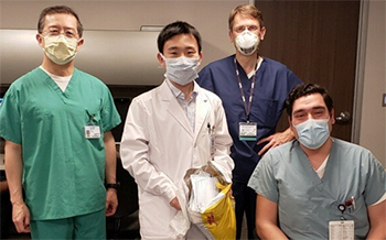 Lin Zhang, Luhua Wei, Marc Lenaerts and Miguel Ruvalcaba from the Department of Neurology with surgical masks donation