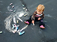 Avery Cunha, left, and Khaleesi and Harper Bruckenstein, enjoying chalk art while their moms enjoy them.