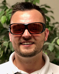 Study participant Alex Zbylut wearing glasses designed to address color blindness. 