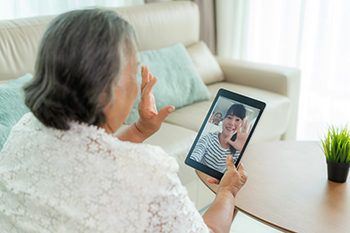 Use technology, rather than in-person visits, to stay in touch with loved ones during times of high heat.